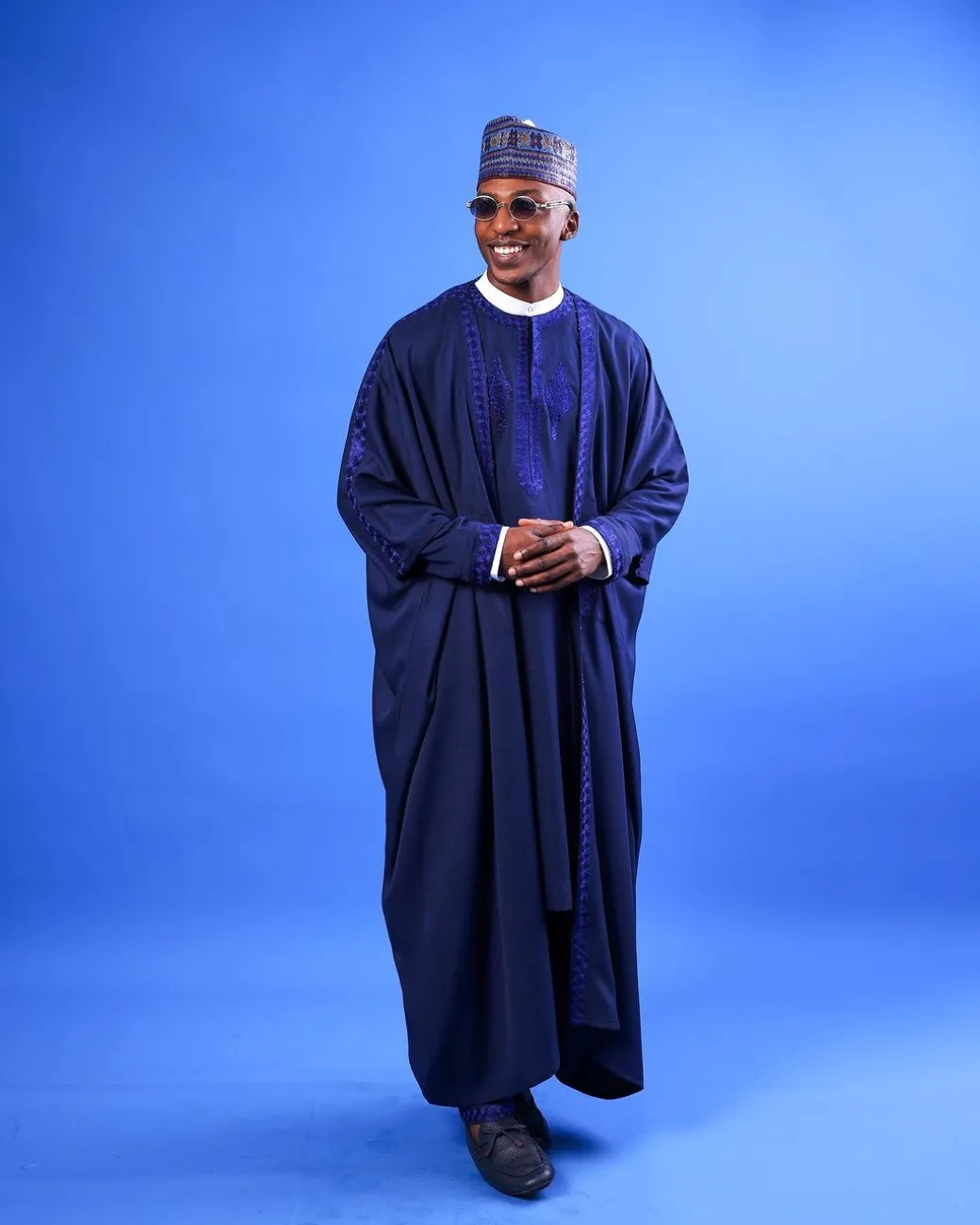A Navy blue, “IBB”, arewa front cut, traditional detailing embroidery details tagbada
