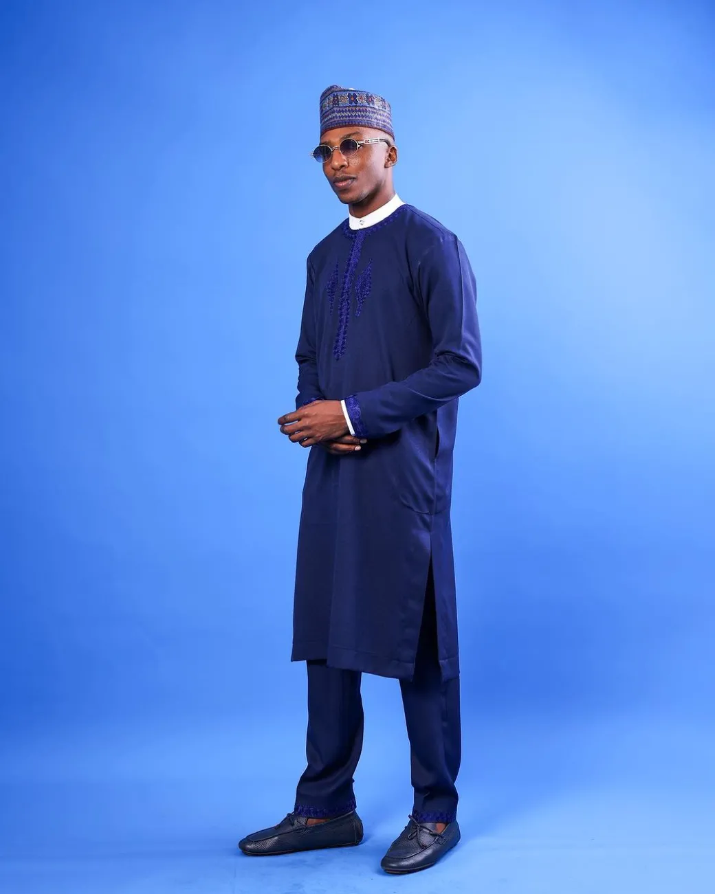 A Navy blue, “IBB”, arewa front cut, traditional detailing embroidery details tagbada