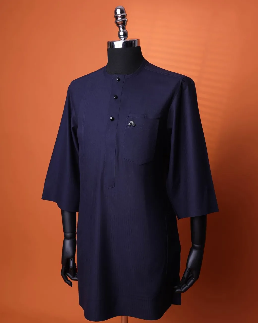 A Navy Blue, invisible pencil stripe, Jorgecarli wool, front flap, layered suit & pen pocket, 3/4 sleeve and clear view silver Swarovski button African senator kaftan native.