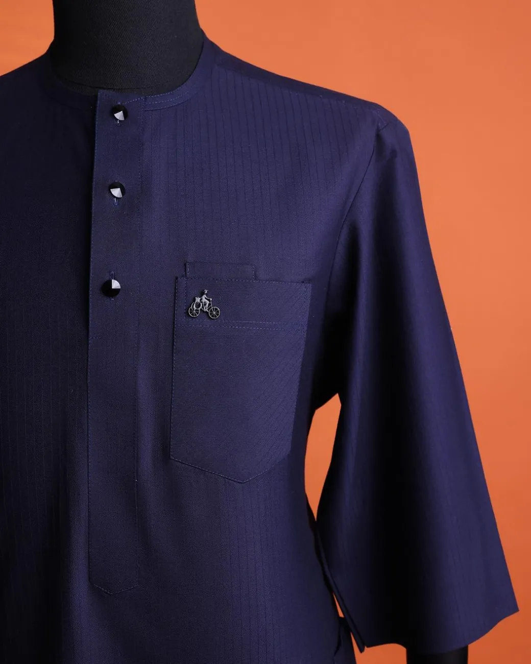 A Navy Blue, invisible pencil stripe, Jorgecarli wool, front flap, layered suit & pen pocket, 3/4 sleeve and clear view silver Swarovski button African senator kaftan native.