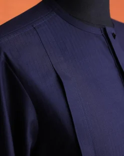 A Navy Blue, invisible pencil stripe, Jorgecarli wool, front flap, layered suit & pen pocket, 3/4 sleeve and clear view silver Swarovski button African senator kaftan native.