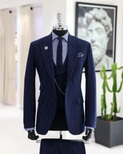A Navy blue, ivory pencil stripe, jorgecarli, peak lapel suit