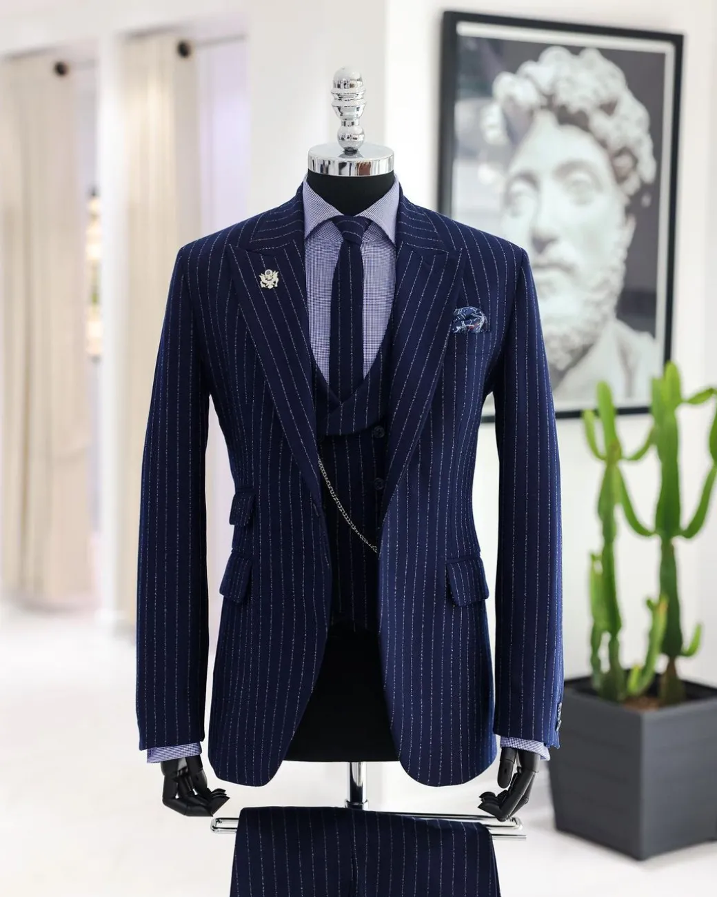 A Navy blue, ivory pencil stripe, jorgecarli, peak lapel suit