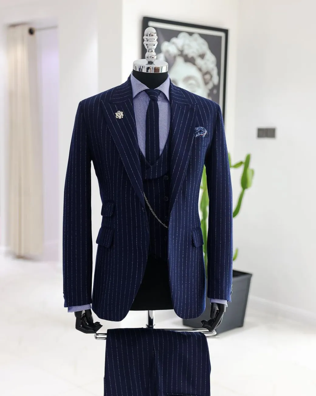 A Navy blue, ivory pencil stripe, jorgecarli, peak lapel suit