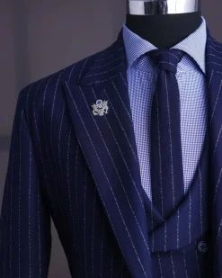 A Navy blue, ivory pencil stripe, jorgecarli, peak lapel suit