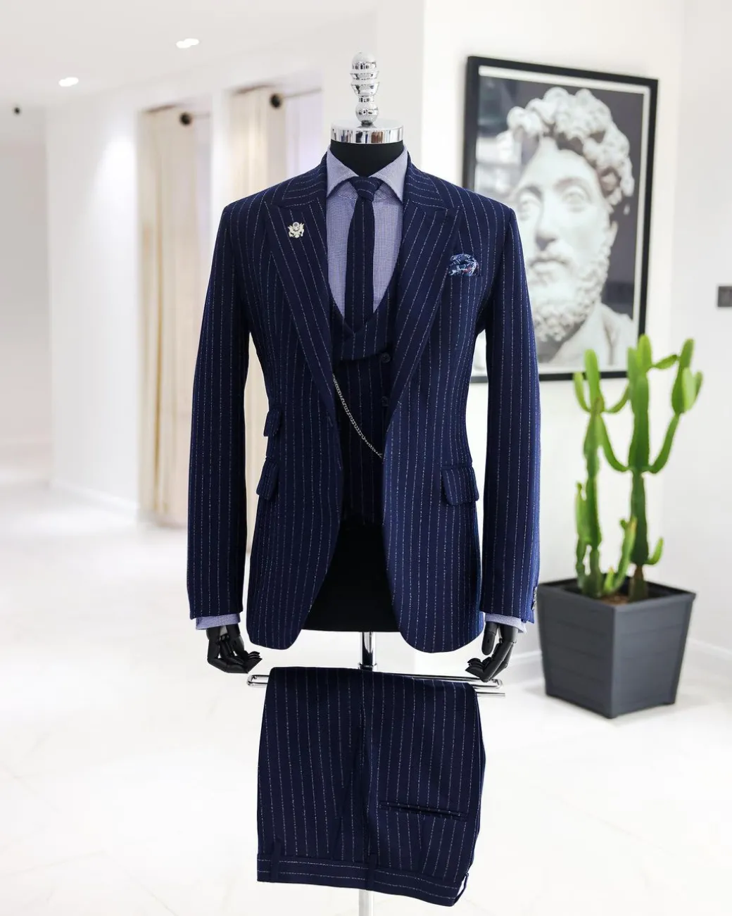 A Navy blue, ivory pencil stripe, jorgecarli, peak lapel suit