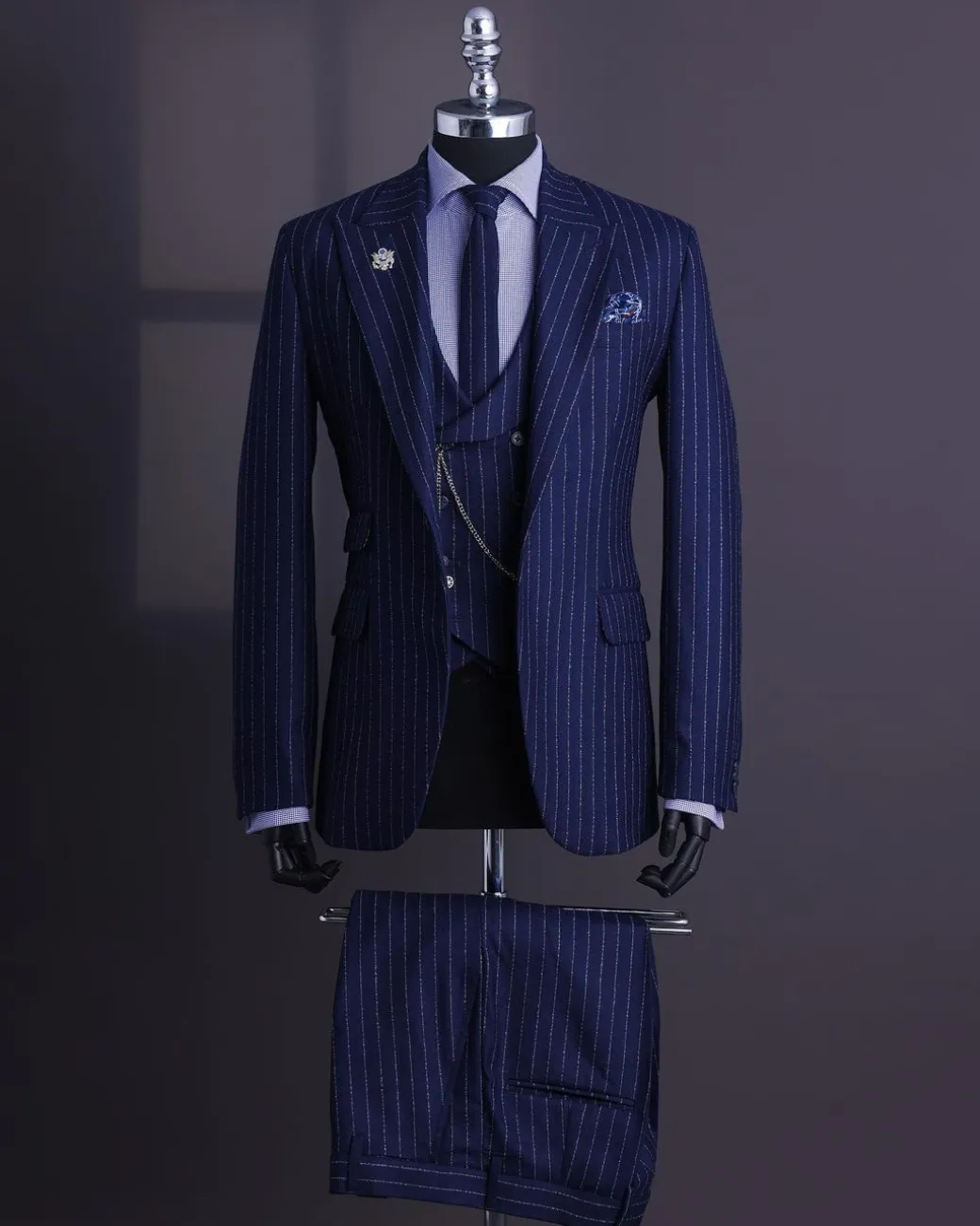 A Navy blue, ivory pencil stripe, jorgecarli, peak lapel suit