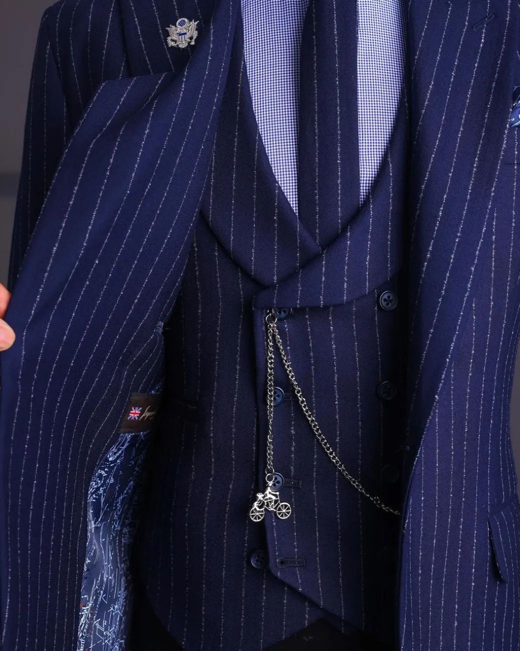 A Navy blue, ivory pencil stripe, jorgecarli, peak lapel suit