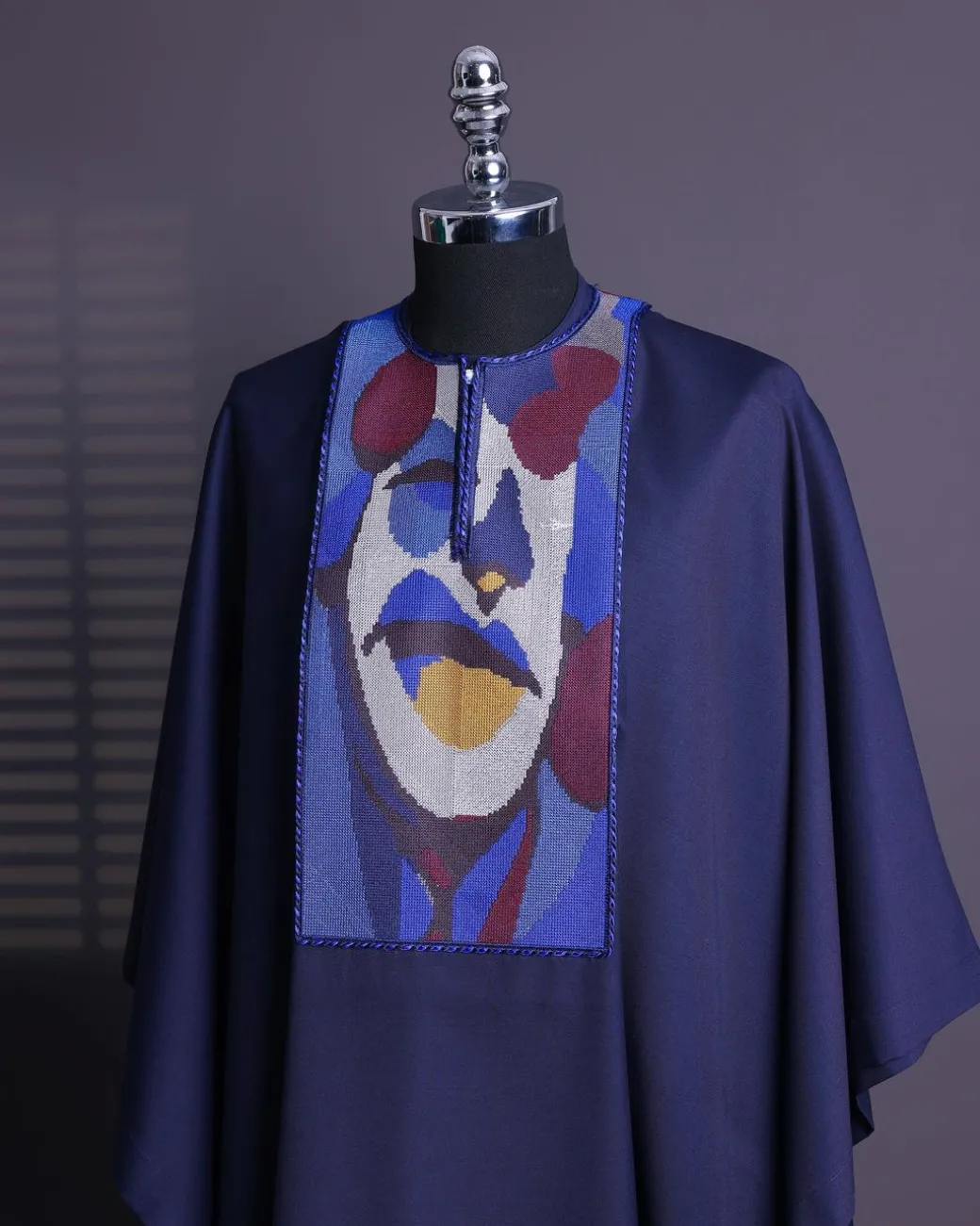 A Navy blue, “Joker” embroidery details agbada