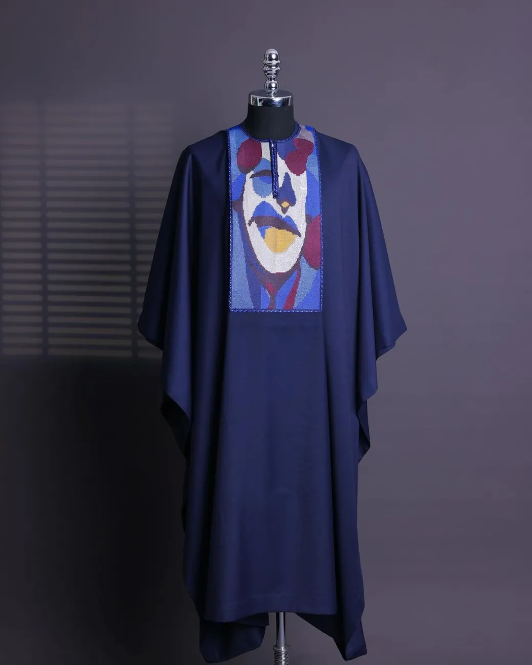 A Navy blue, “Joker” embroidery details agbada