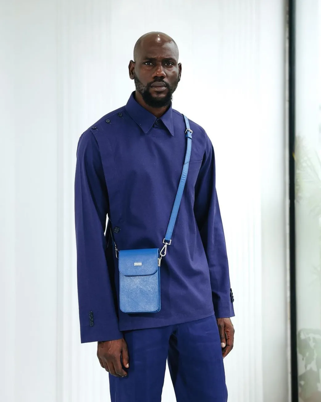 A Navy blue, layered front-covered shirt.
