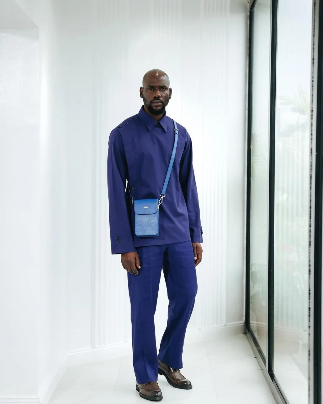 A Navy blue, layered front-covered shirt.