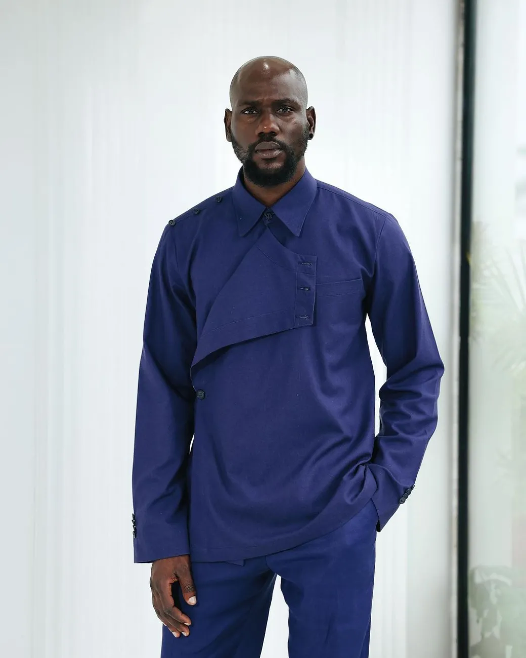 A Navy blue, layered front-covered shirt.