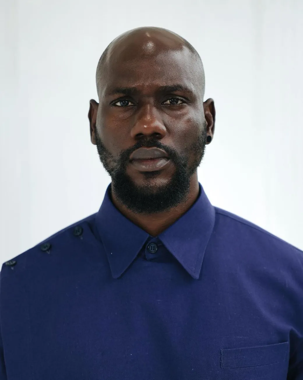 A Navy blue, layered front-covered shirt.