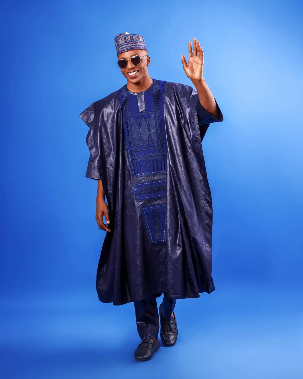 A Navy blue, Malian with layered dropped square pattern jacquard embroidery details, traditional Agbada