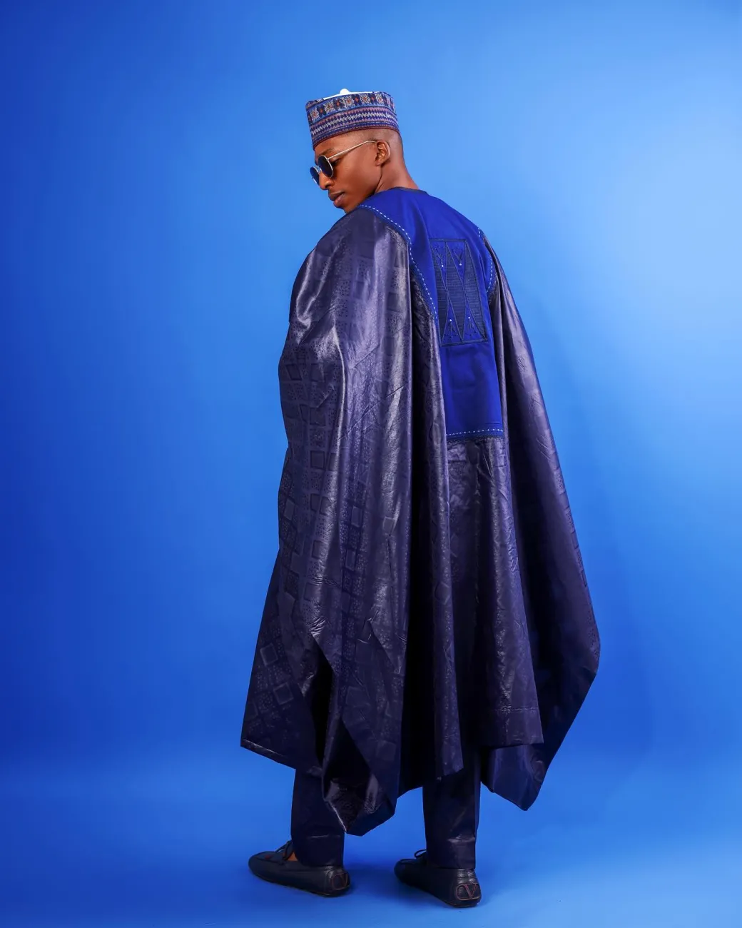 A Navy blue, Malian with layered dropped square pattern jacquard embroidery details, traditional Agbada