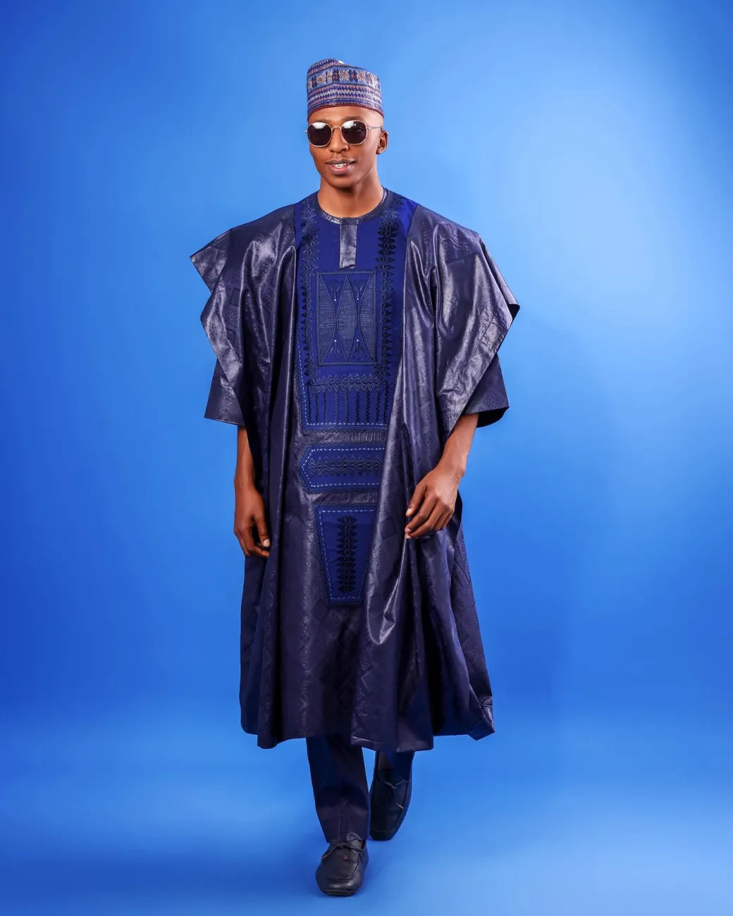 A Navy blue, Malian with layered dropped square pattern jacquard embroidery details, traditional Agbada