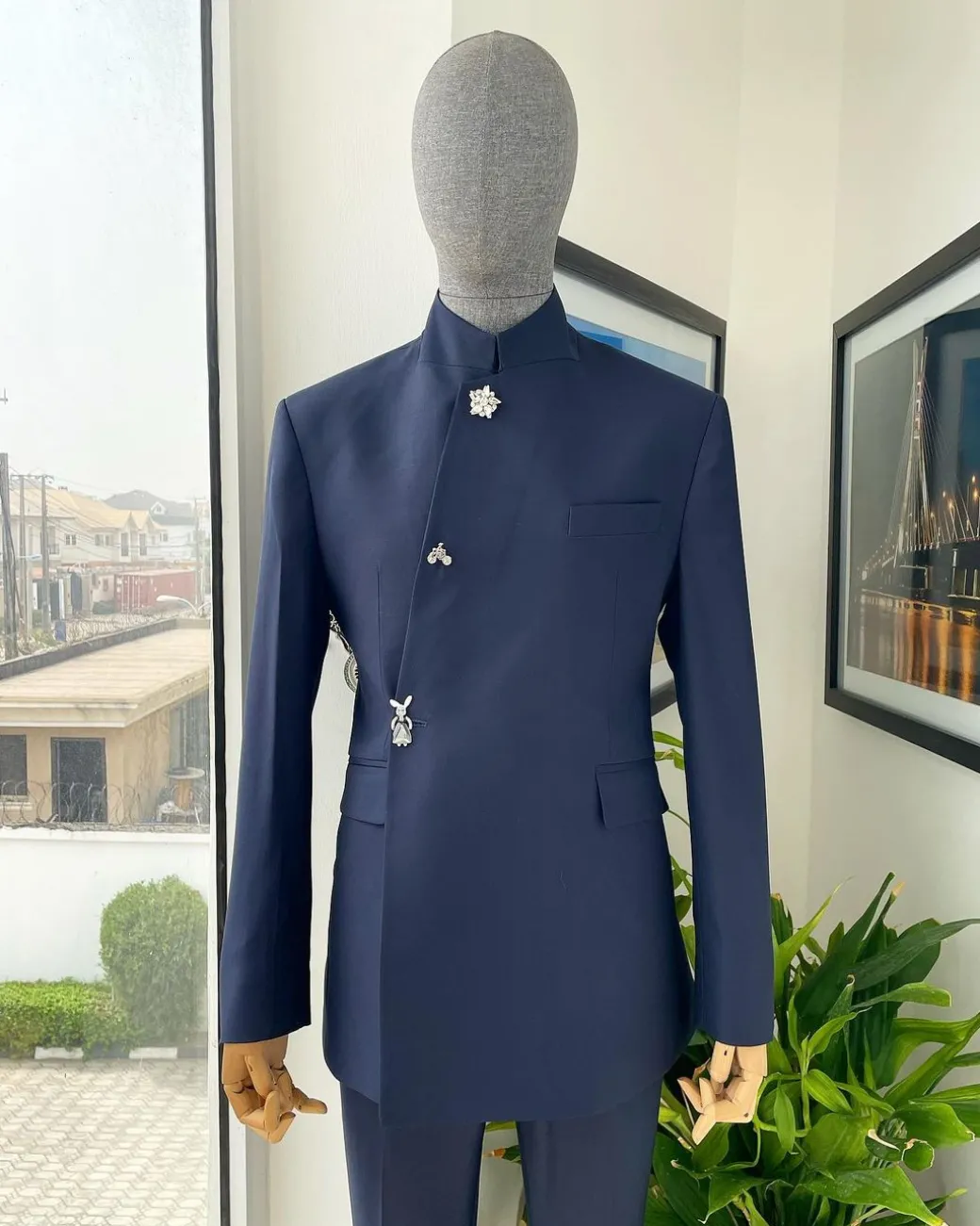 A Navy blue “parabellum”, wrap notch lapel blazer suit