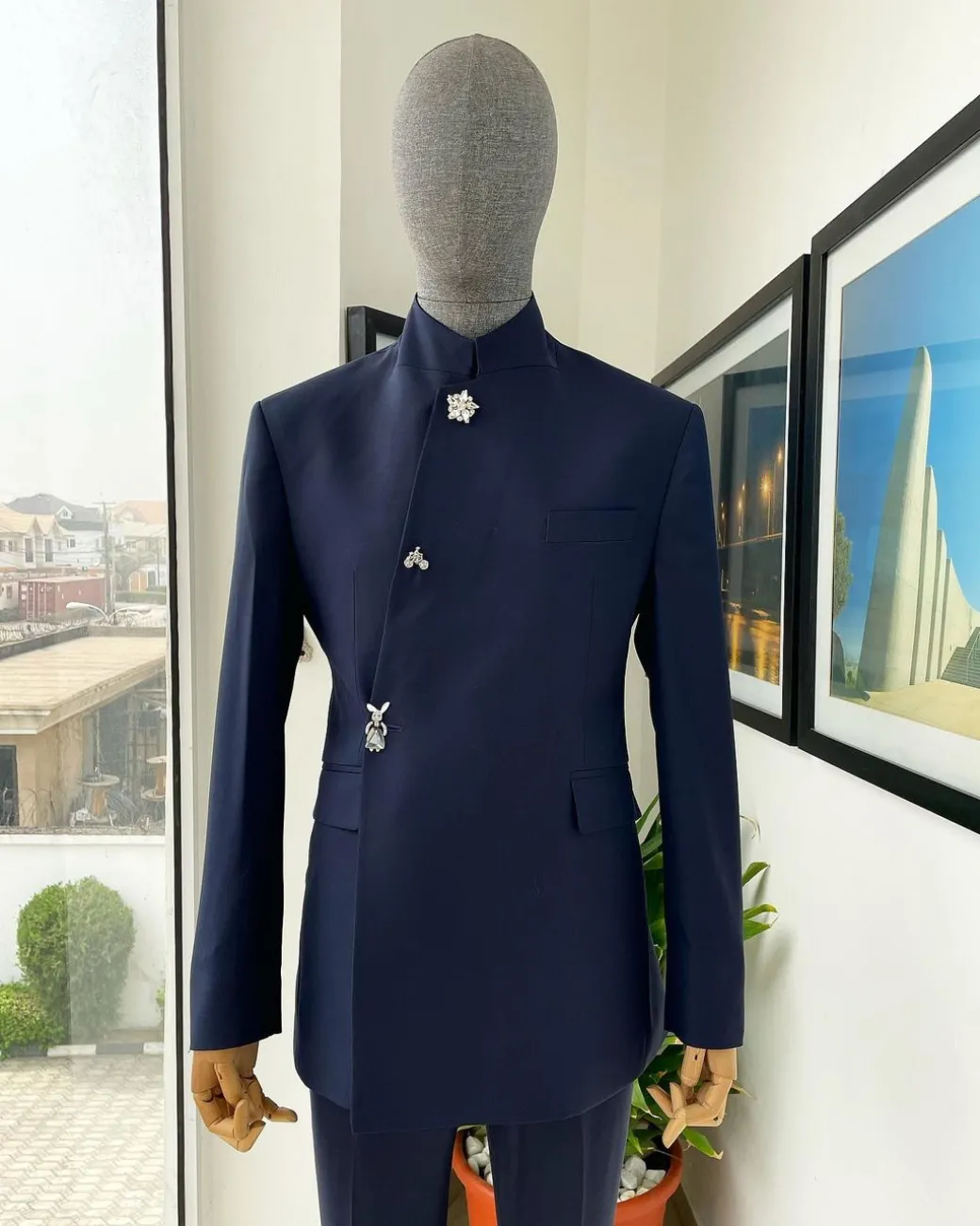 A Navy blue “parabellum”, wrap notch lapel blazer suit