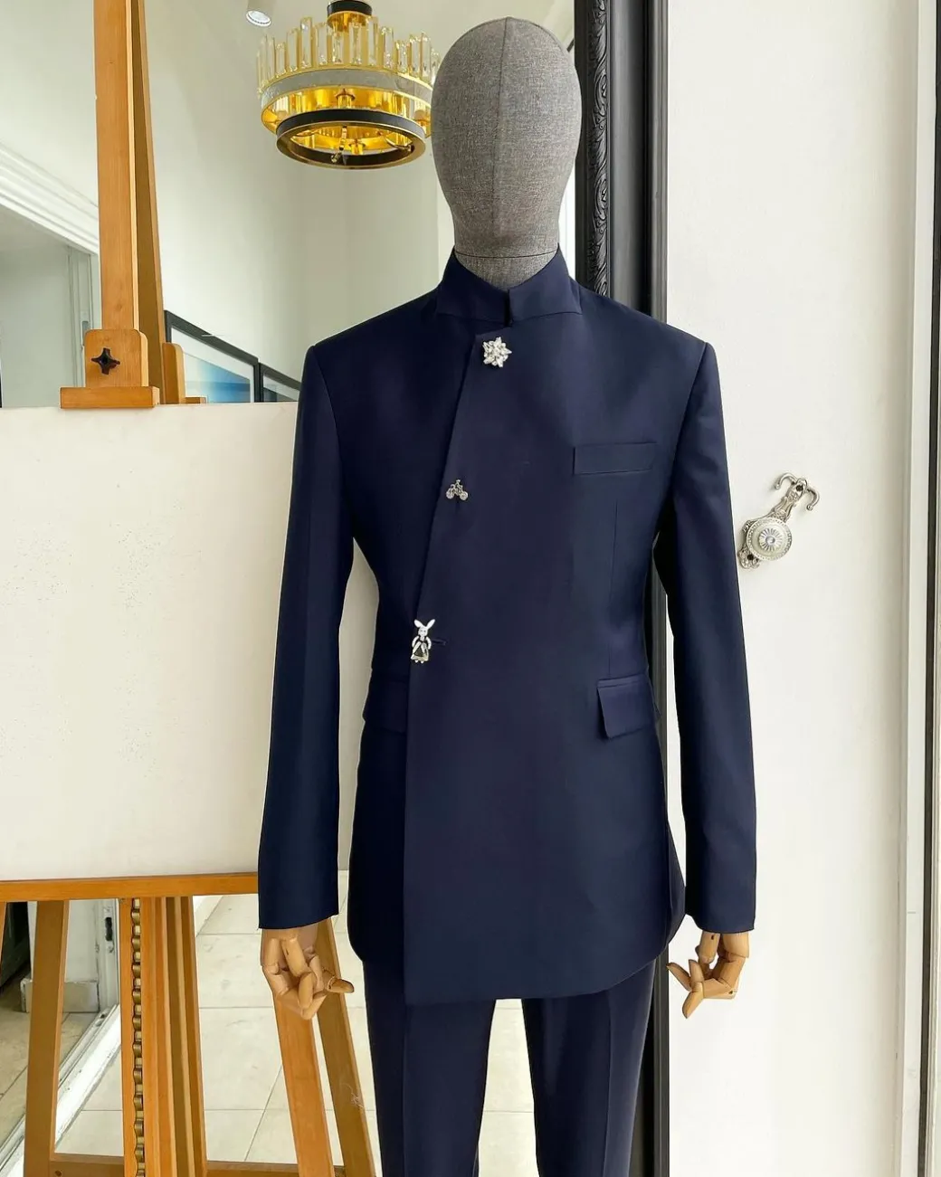 A Navy blue “parabellum”, wrap notch lapel blazer suit