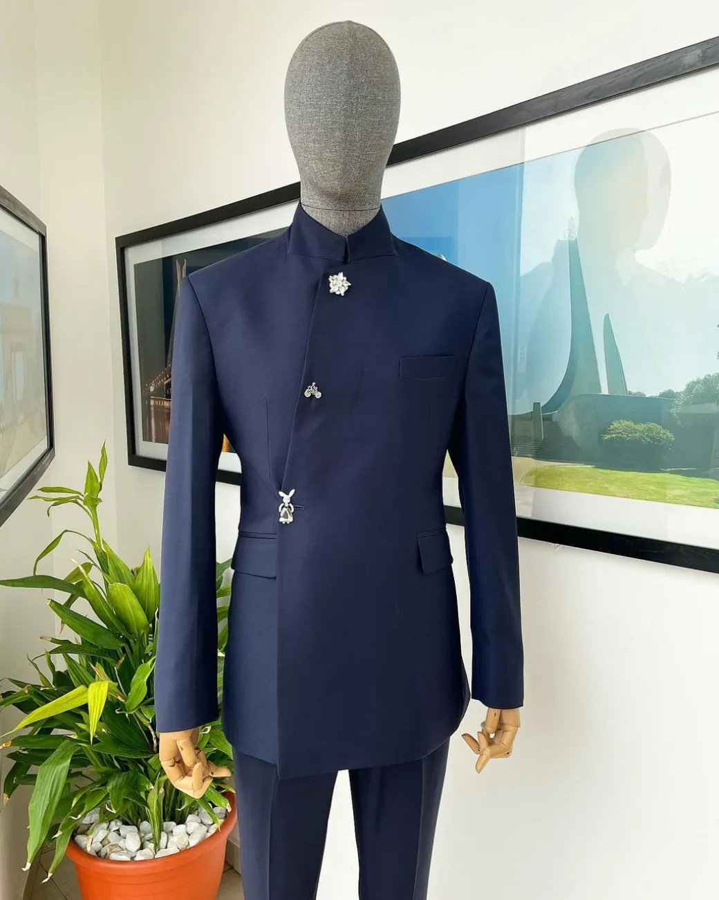 A Navy blue “parabellum”, wrap notch lapel blazer suit