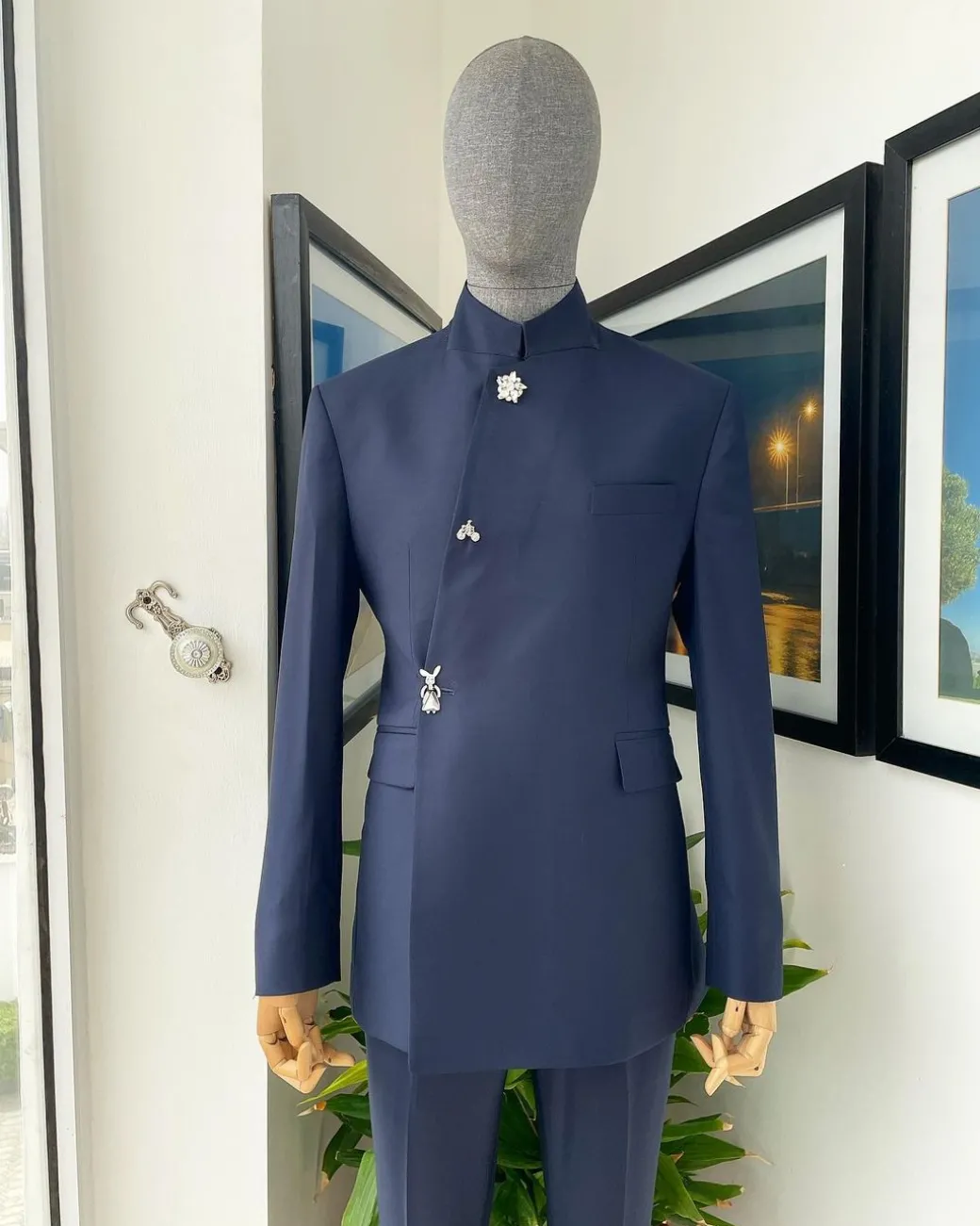 A Navy blue “parabellum”, wrap notch lapel blazer suit