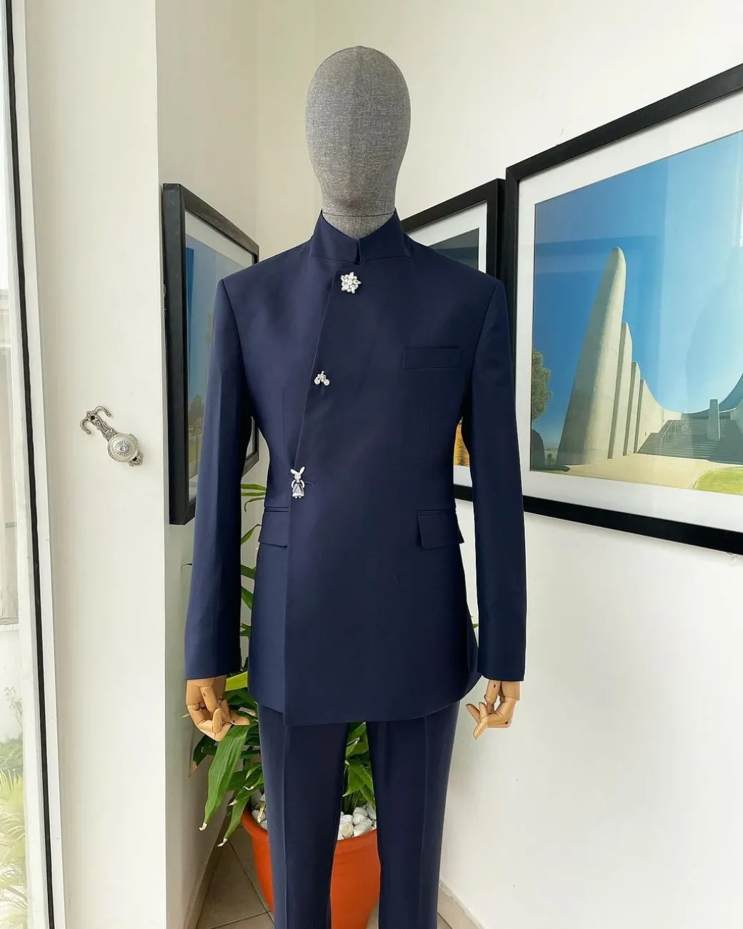 A Navy blue “parabellum”, wrap notch lapel blazer suit