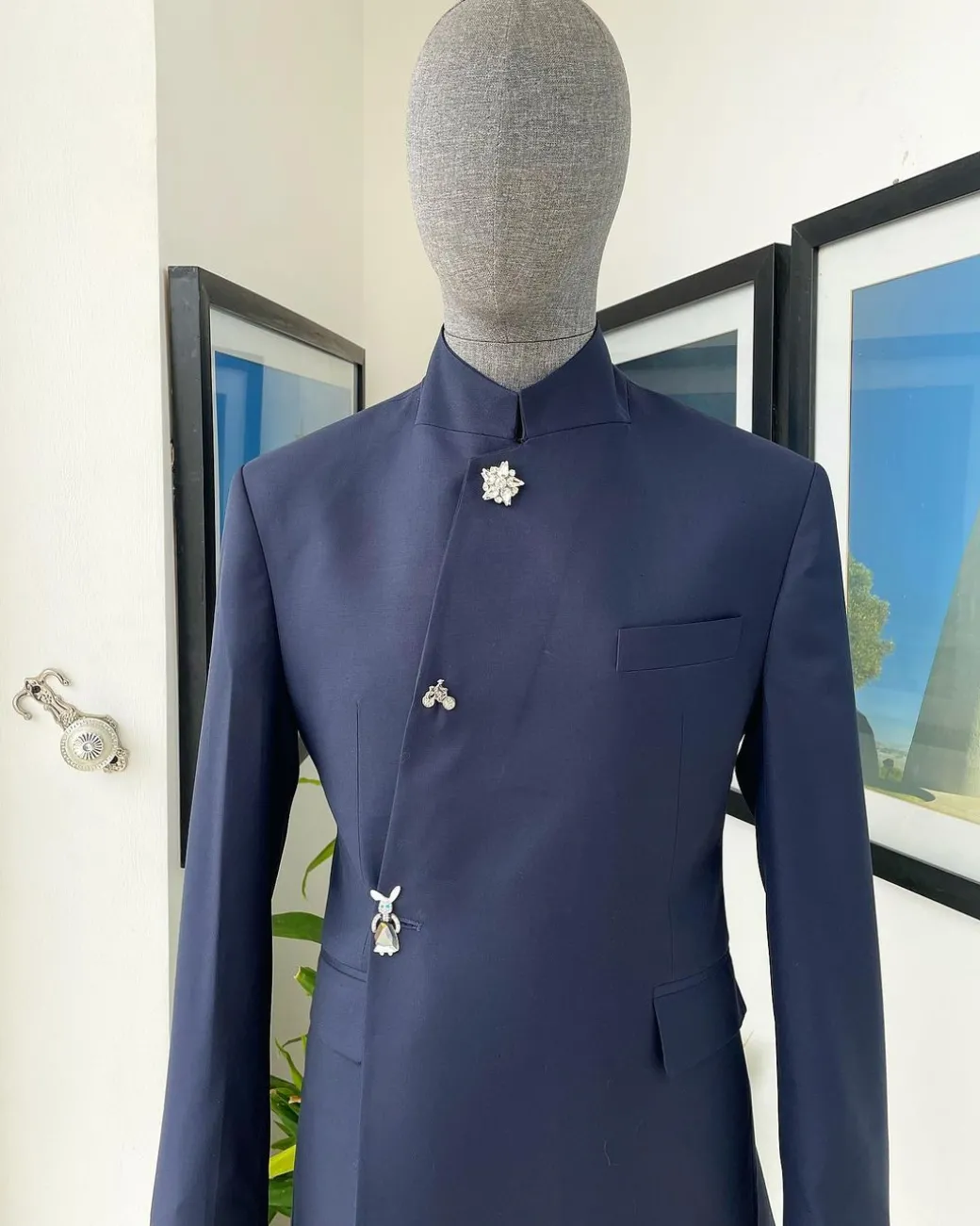 A Navy blue “parabellum”, wrap notch lapel blazer suit