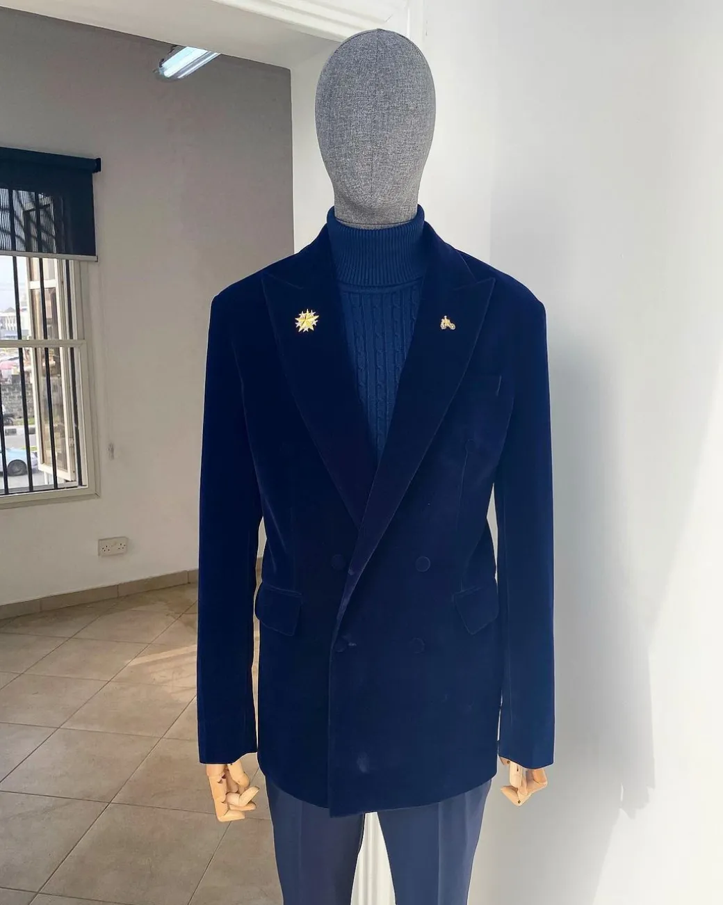 A Navy Blue peak lapel double breasted soaked Italian velvet tuxedo suit