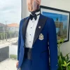 A Navy blue peak lapel tuxedo suit