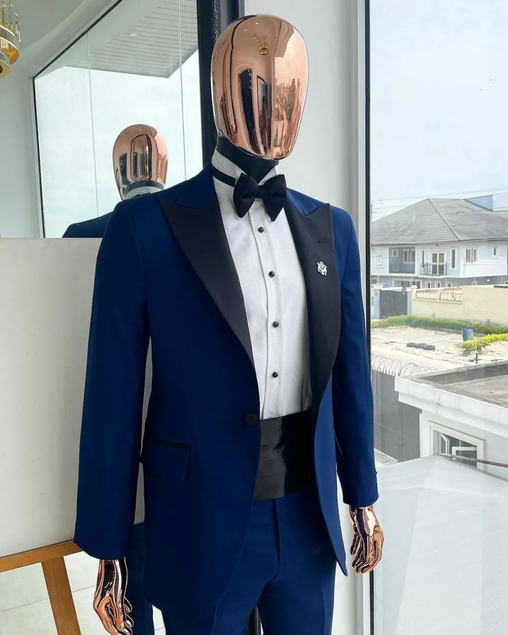 A Navy blue peak lapel tuxedo suit