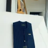 A Navy blue pencil stripe with reverse line pocket, zip line front flap, African kaftan native