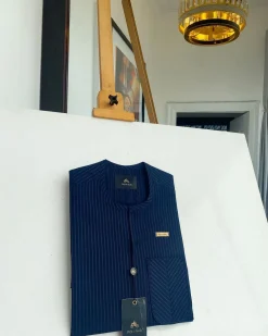 A Navy blue pencil stripe with reverse line pocket, zip line front flap, African kaftan native