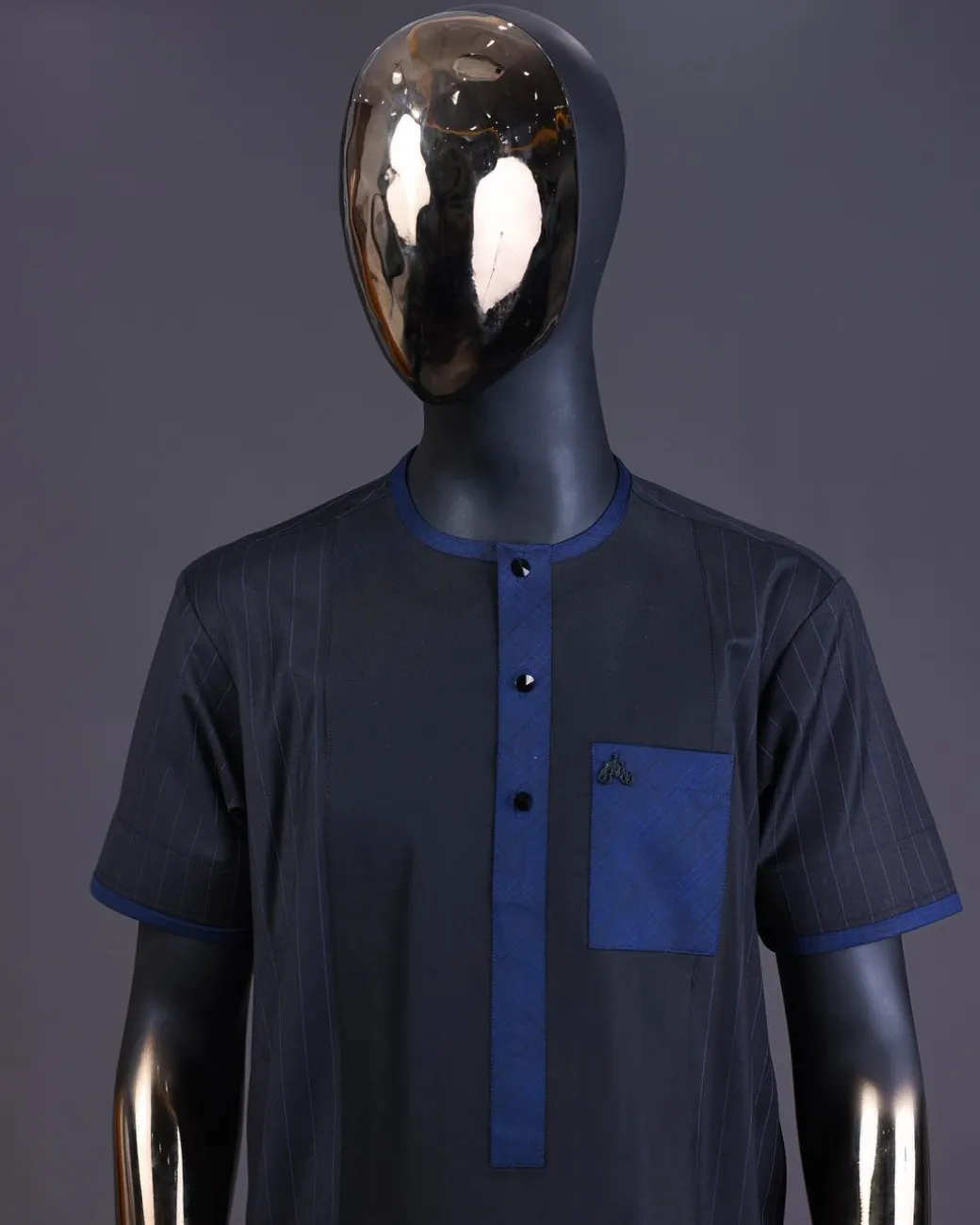 A Navy blue pencil stripe on black, black front with matching blue-black Swarovski button detailing kaftan and Sokoto