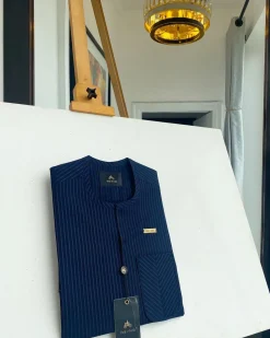 A Navy blue pencil stripe with reverse line pocket, zip line front flap, African kaftan native