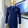 A Navy blue pinstripe double-breasted “Board Room” peak lapel suit