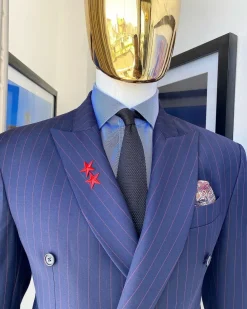 A Navy blue pinstripe double-breasted “Board Room” peak lapel suit