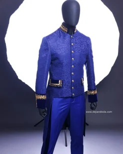 A Navy blue “Prince of Persia” ceremonial tail suit, Gold Metal Wire hand woven embroidery detail mix on velvet