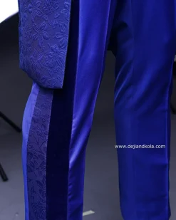 A Navy blue “Prince of Persia” ceremonial tail suit, Gold Metal Wire hand woven embroidery detail mix on velvet