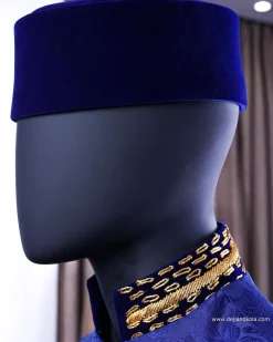 A Navy blue “Prince of Persia” ceremonial tail suit, Gold Metal Wire hand woven embroidery detail mix on velvet