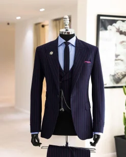 A Navy blue, red pencil stripe, jorgecarli, peak lapel suit.