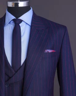 A Navy blue, red pencil stripe, jorgecarli, peak lapel suit.