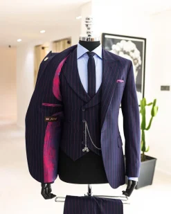 A Navy blue, red pencil stripe, jorgecarli, peak lapel suit.
