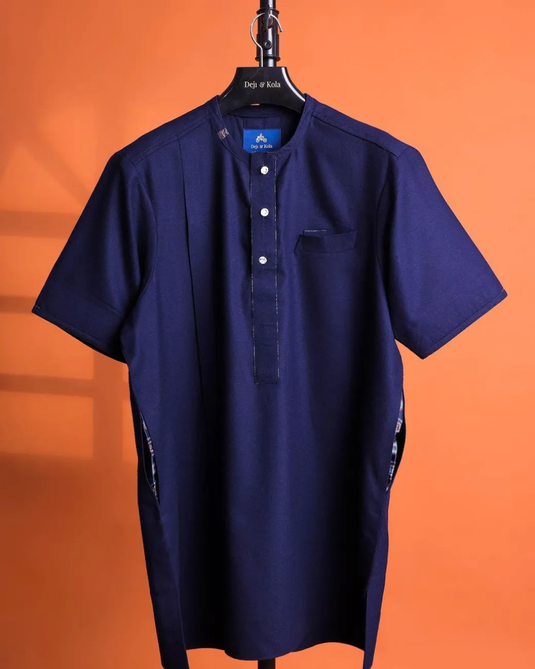 A Navy blue, 120s jorgecarli wool, front flap, short sleeve with clear view Swarovski button details African traditional senator kaftan native.