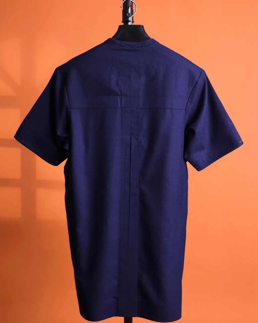 A Navy blue, 120s jorgecarli wool, front flap, short sleeve with clear view Swarovski button details African traditional senator kaftan native.