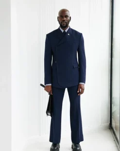A Navy Blue, Seersucker, “Herd” Warp Peak Lapel Suit.
