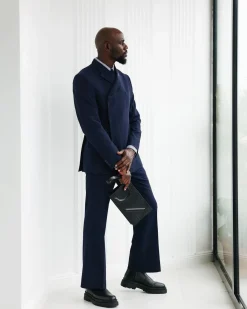 A Navy Blue, Seersucker, “Herd” Warp Peak Lapel Suit.