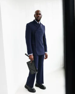 A Navy Blue, Seersucker, “Herd” Warp Peak Lapel Suit.