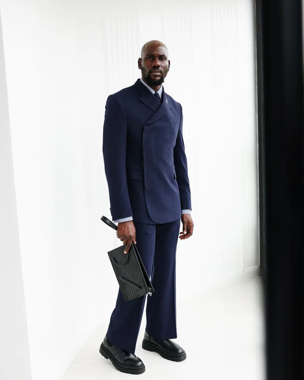 A Navy Blue, Seersucker, “Herd” Warp Peak Lapel Suit.