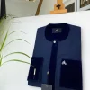 A Navy blue senator with a velvet flap pocket and cuff detail African Kaftan